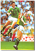 Niall Quinn and Tonyca Scarino go flying in a second-round match pitting Ireland against Romania. Ireland won in a penalty-kick shootout, 5-4.